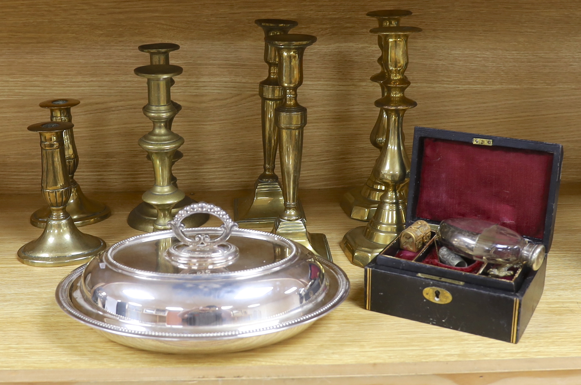 Four pairs of brass candlesticks, silver plated tureen and cover and a leather jewellery box with sundry collectibles